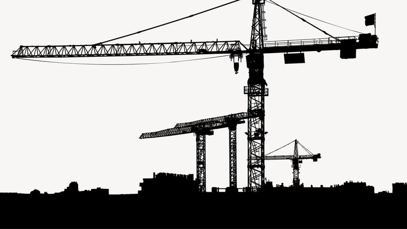 Construction site silhouette background, crane. File photograph.