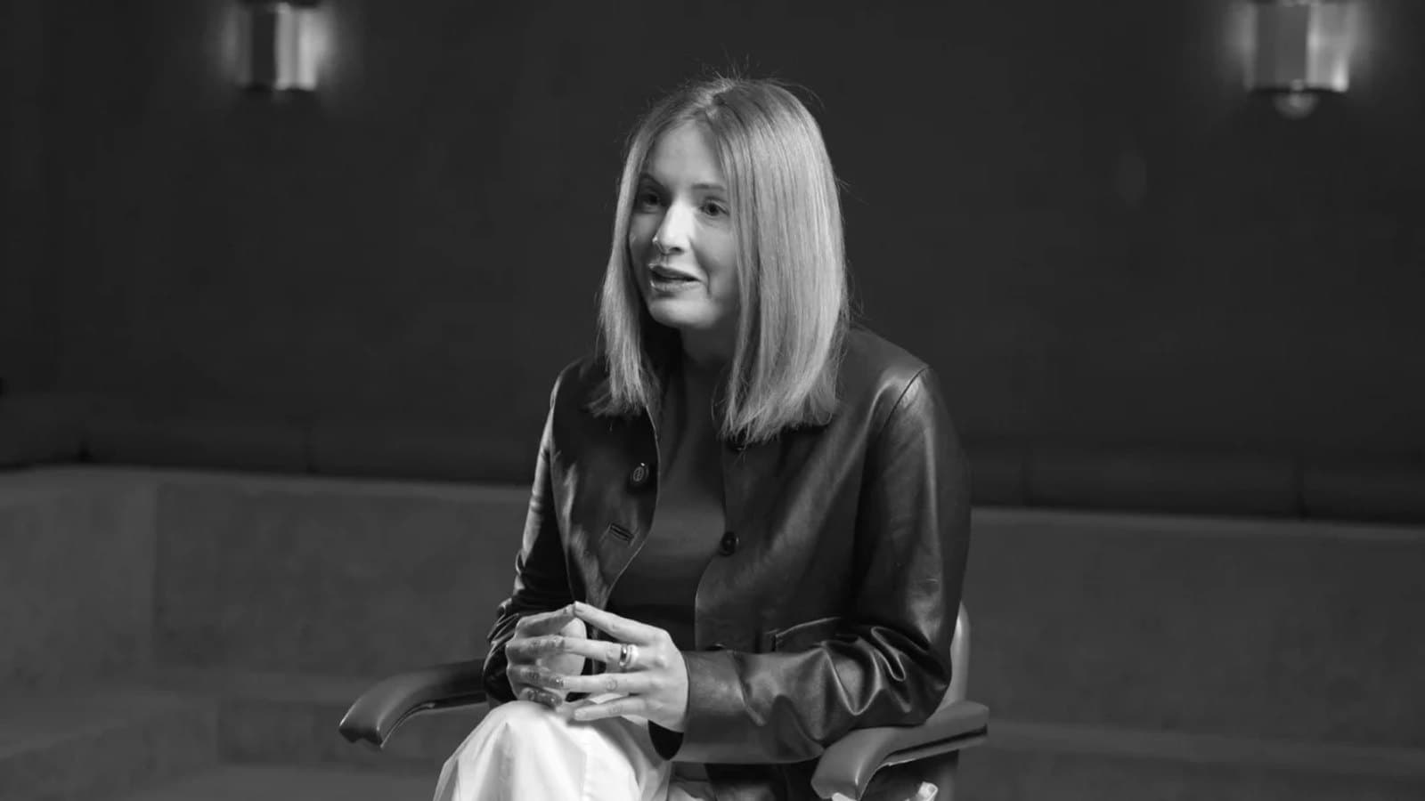 Black and white portrait of Doris Casares speaking during an interview